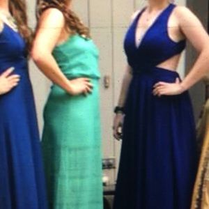 Stunning floor length blue dress, crossed back